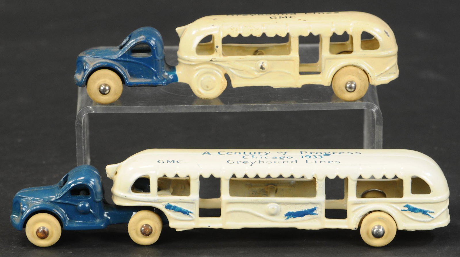 TWO CENTURY OF PROGRESS GREYHOUNDS: 26. TWO CENTURY OF PROGRESS GREYHOUNDS | Lot includes small GMC example and medium 1933 Chicago bus. 5.5" - 7.5" l. | (Pristine to Near Mint Condition) | $300 - $500