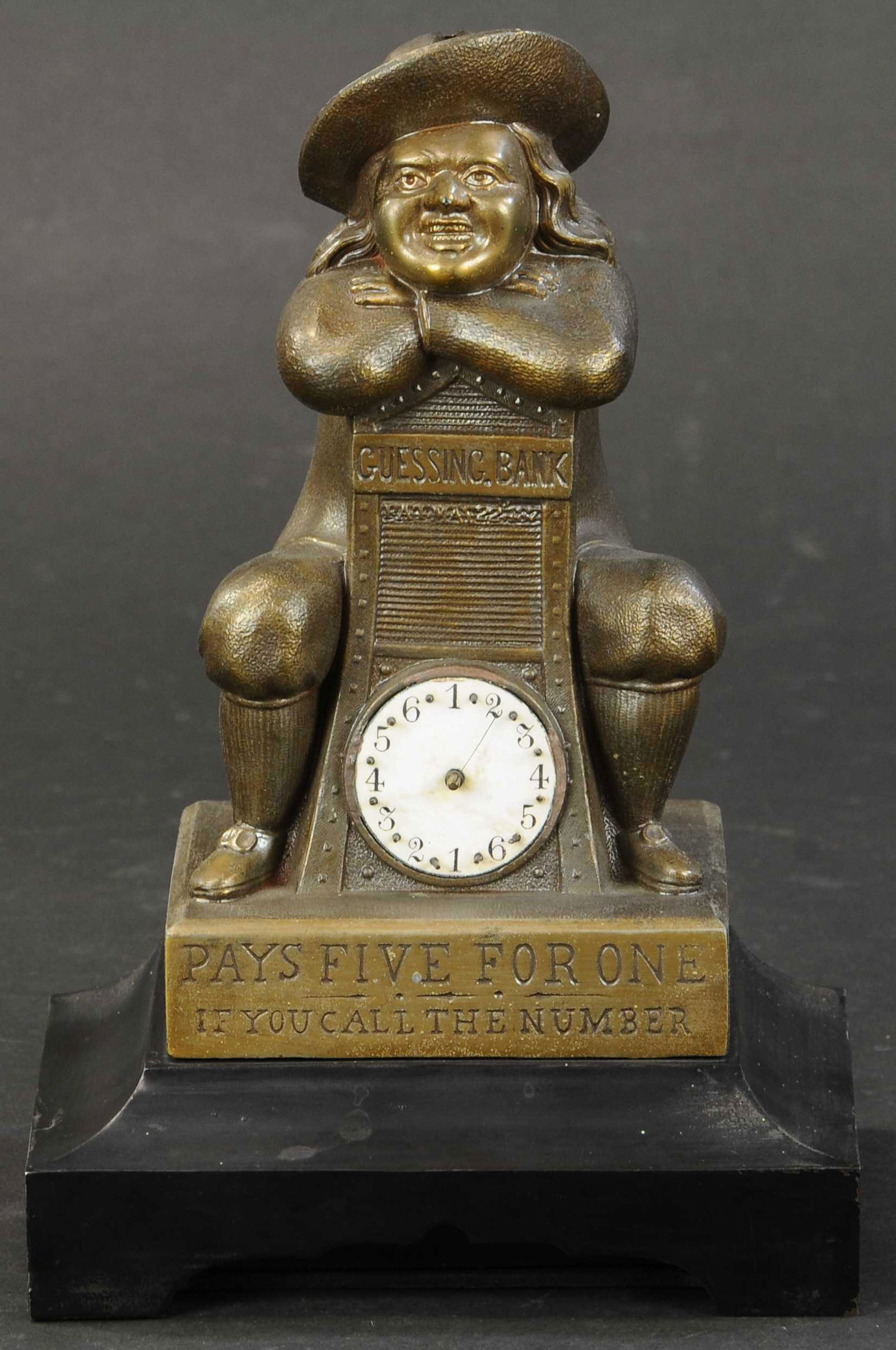 GUESSING BANK MECHANICAL BANK: 382. GUESSING BANK MECHANICAL BANK | Designed by Edward J. McLoughlin, NY, patented May 22, 1877. Provenance: Bob Weiss Collection. | Small corner chip to inside of coin tray, internal lock mechanism