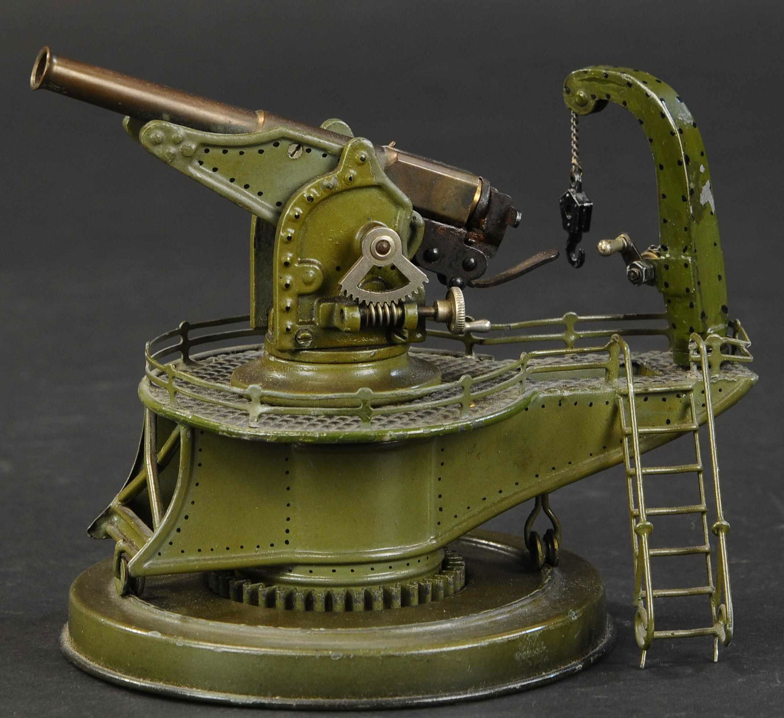 MARKLIN COASTAL GUN: 1058. MARKLIN COASTAL GUN | Small scale version of popular anti-aircraft gun on circular base. | 8" l. | Crane is replaced, otherwise in (Excellent Condition) | $1,000 - $1,500