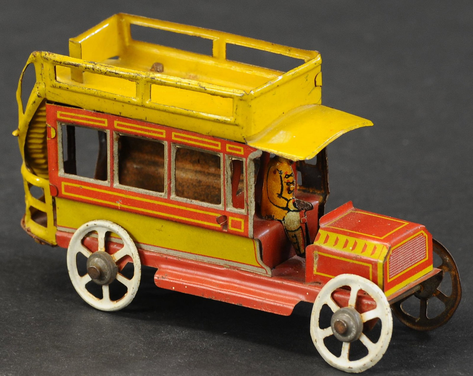 DISTLER BUS PENNY TOY: 1080. DISTLER BUS PENNY TOY | 4.25" l. | Rust at bottom of back steps, otherwise in (Excellent Condition) | $200 - $300