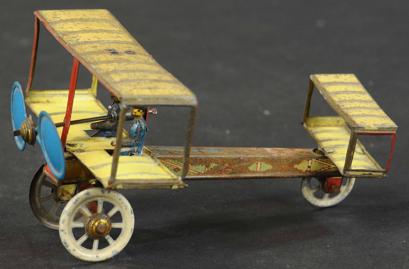 DISTLER BIPLANE WITH TWO PILOTS: 1096. DISTLER BIPLANE WITH TWO PILOTS | 5" l. | (Very Good Condition) | $600 - $900