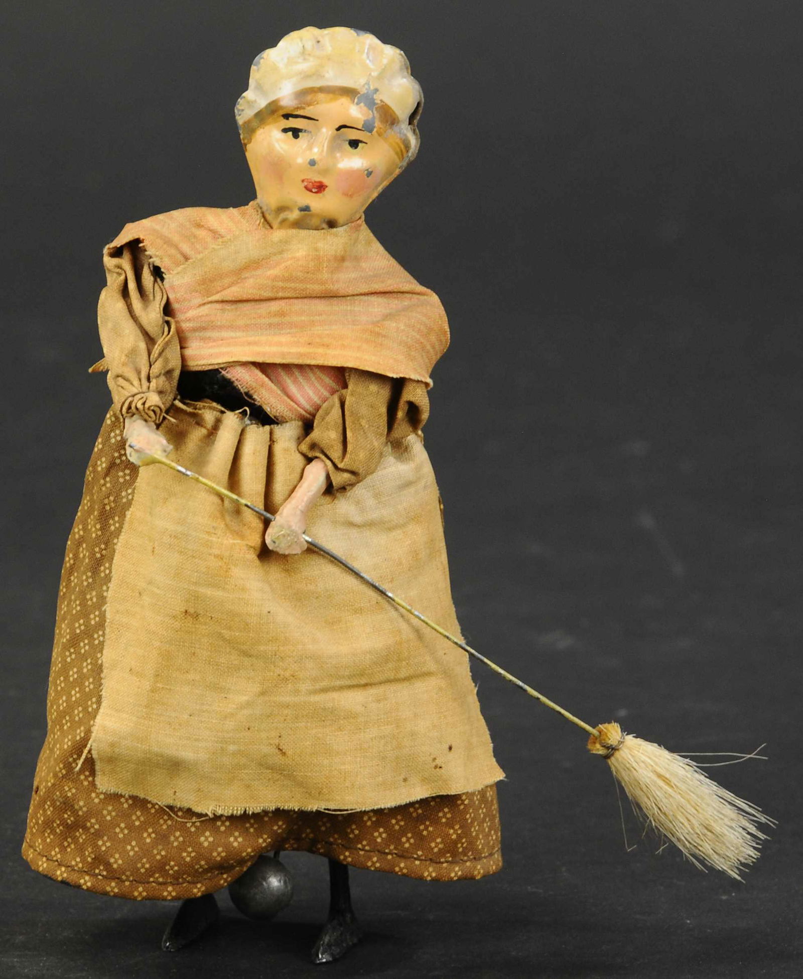 FERNAND MARTIN WOMAN WITH BROOM: 1127. FERNAND MARTIN WOMAN WITH BROOM | | A wonderful depiction of an important part of Parisian life, the French housekeeper, busily sweeping her floors. | 7" h. | Head is restored, broom has been re