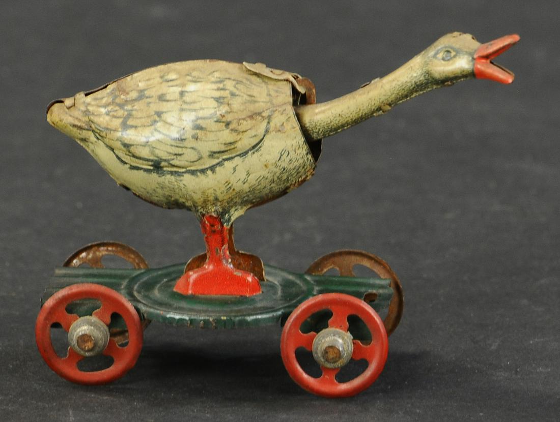 NODDING GOOSE PENNY TOY: 1155. NODDING GOOSE PENNY TOY | 3.5" l. | (Excellent Condition) | $200 - $300