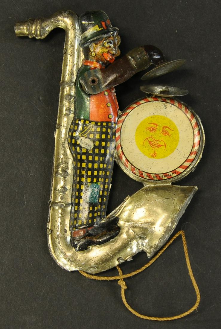 NIFTY MINSTREL TRUMPET CHIME TOY: 1465. NIFTY MINSTREL TRUMPET CHIME TOY | 5" h. | (Very Good Condition) | $200 - $400