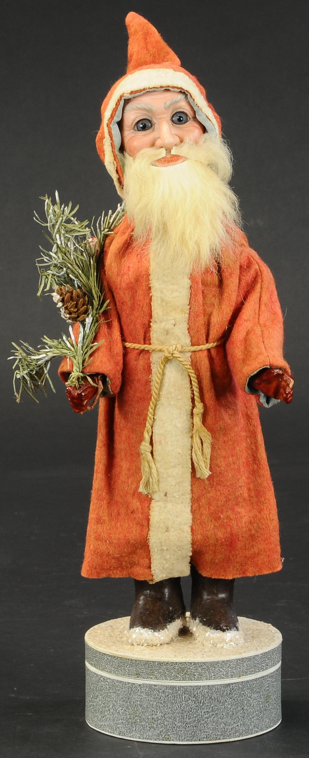 BLUE GLASS EYE SANTA SQUEAKER TOY (1 of 3)