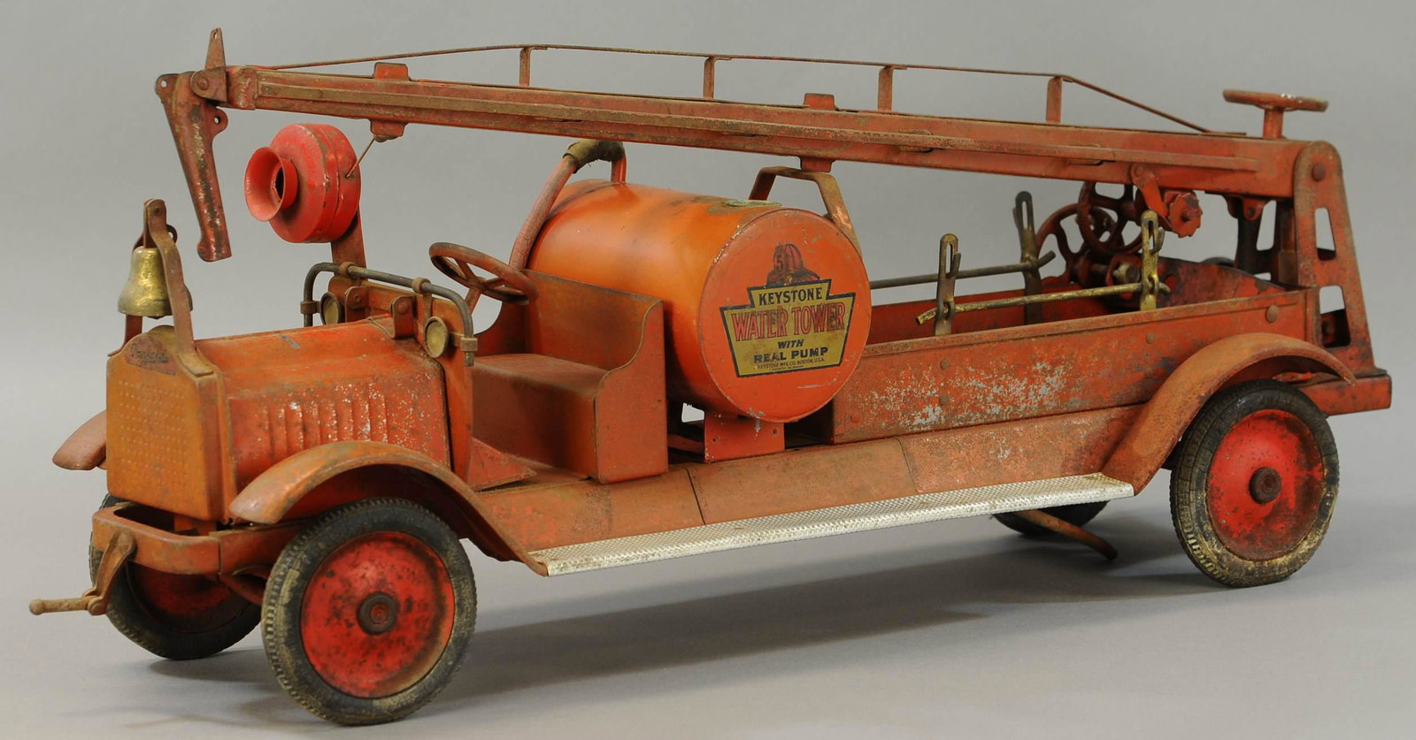 KEYSTONE WATER TOWER TRUCK: 25. KEYSTONE WATER TOWER TRUCK | 32" l. | Missing side ladders, otherwise paint in All Original Condition. | $300 - $600