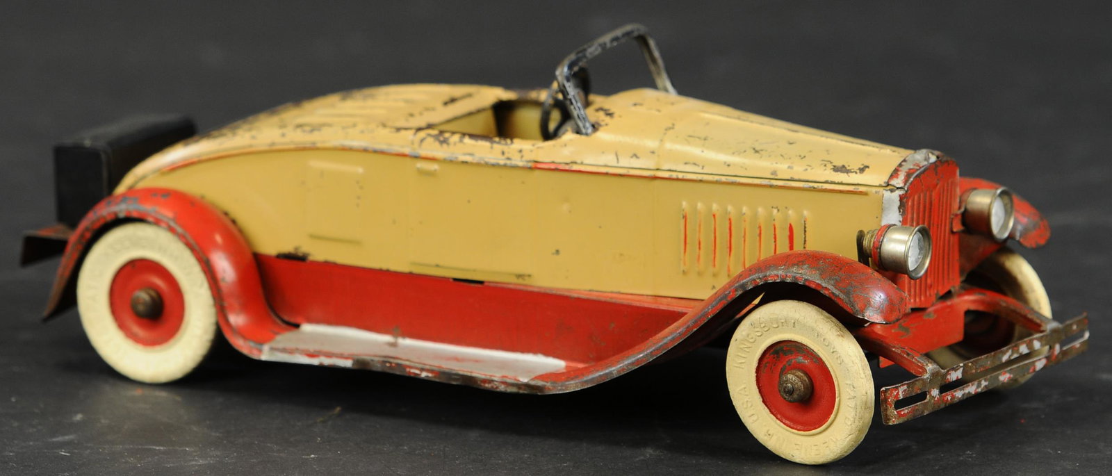 KINGSBURY CONVERTIBLE COUPE: 49. KINGSBURY CONVERTIBLE COUPE | 13" l. | Luggage rack replaced, steering wheel reattached. | $200 - $400