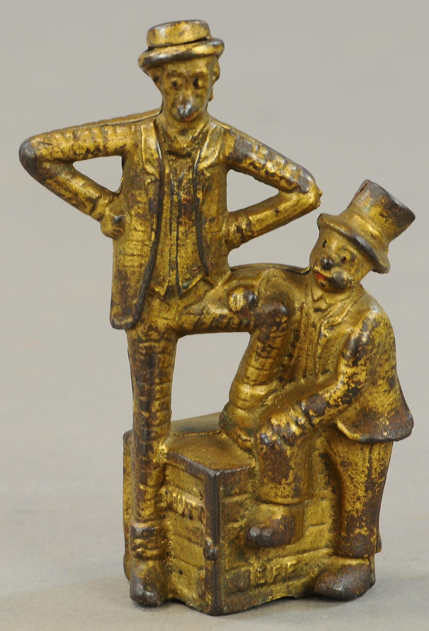 MUTT & JEFF CAST IRON STILL BANK: 66. MUTT & JEFF CAST IRON STILL BANK | 5.5" h. | All Original Condition. | $50 - $100
