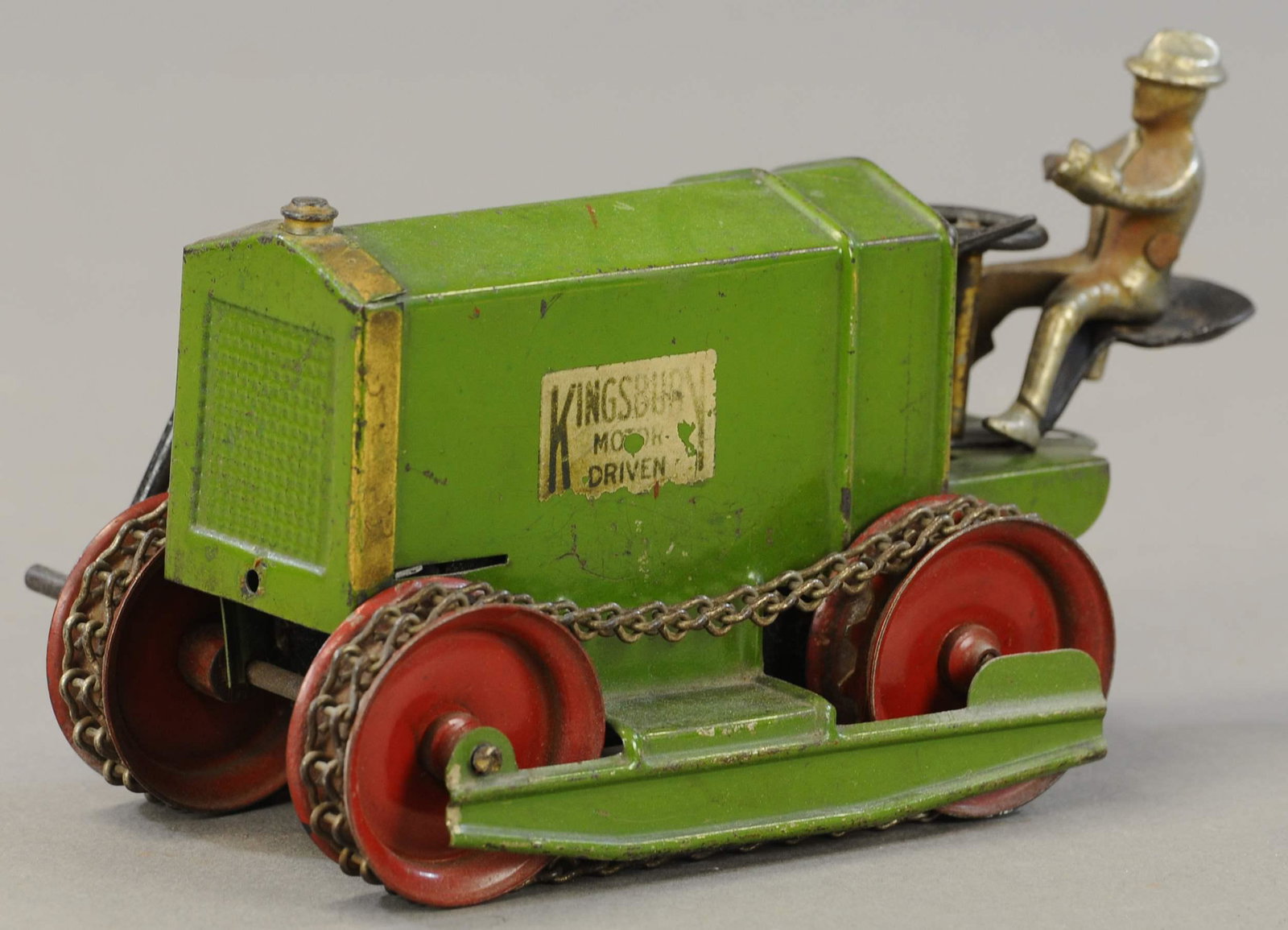 KINGSBURY MOTOR DRIVEN TRACTOR: 115. KINGSBURY MOTOR DRIVEN TRACTOR | 8.5" l. | Driver has one arm broken, otherwise working in All Original Condition. | $125 - $250