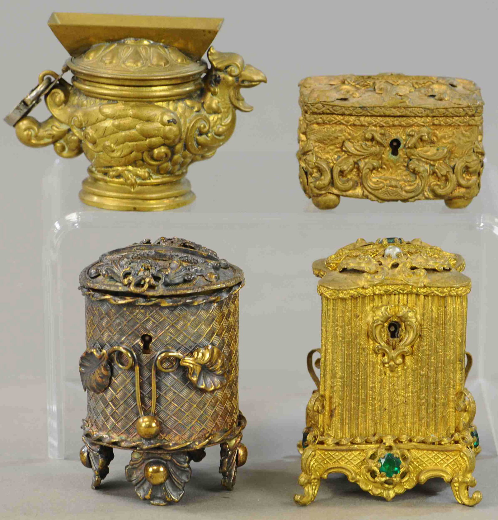 FOUR ORNATE BRASS STILL BANKS: 190. FOUR ORNATE BRASS STILL BANKS | 3" - 4" h. | Overall in (Exc. Cond.) | $150 - $300