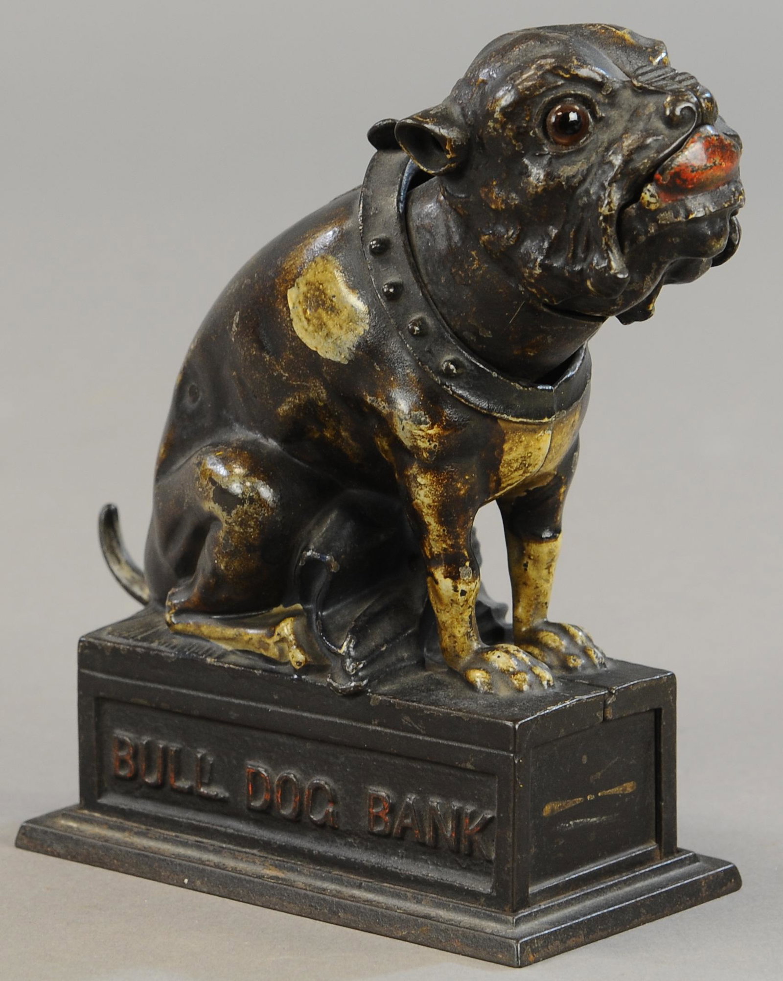 BULLDOG COIN ON NOSE MECHANICAL BANK: 204. BULLDOG COIN ON NOSE MECHANICAL BANK | Trap is replaced, paint in All Original Condition. | $300 - $600