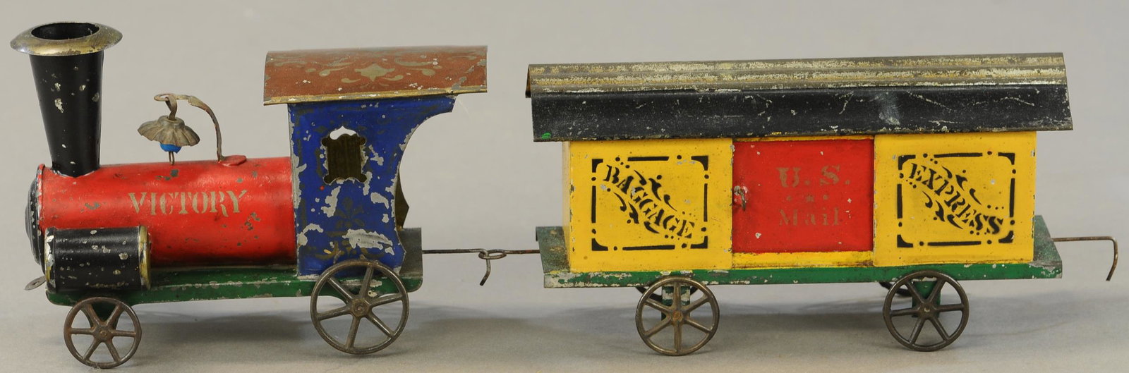 MEDIUM AMERICAN TIN LOCO & COACH: 224. MEDIUM AMERICAN TIN LOCO & COACH | Nice example of a cute George Brown toy. | 6" - 7" l. | Repainted. | $250 - $500