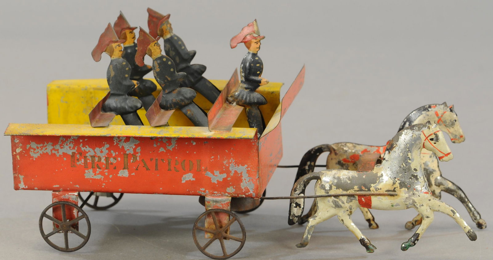 ALTHOF BERGMANN FIRE PATROL WAGON: 229. ALTHOF BERGMANN FIRE PATROL WAGON | 13" l. | One horse and one wheel bracket resoldered, figures are replaced. | $200 - $400