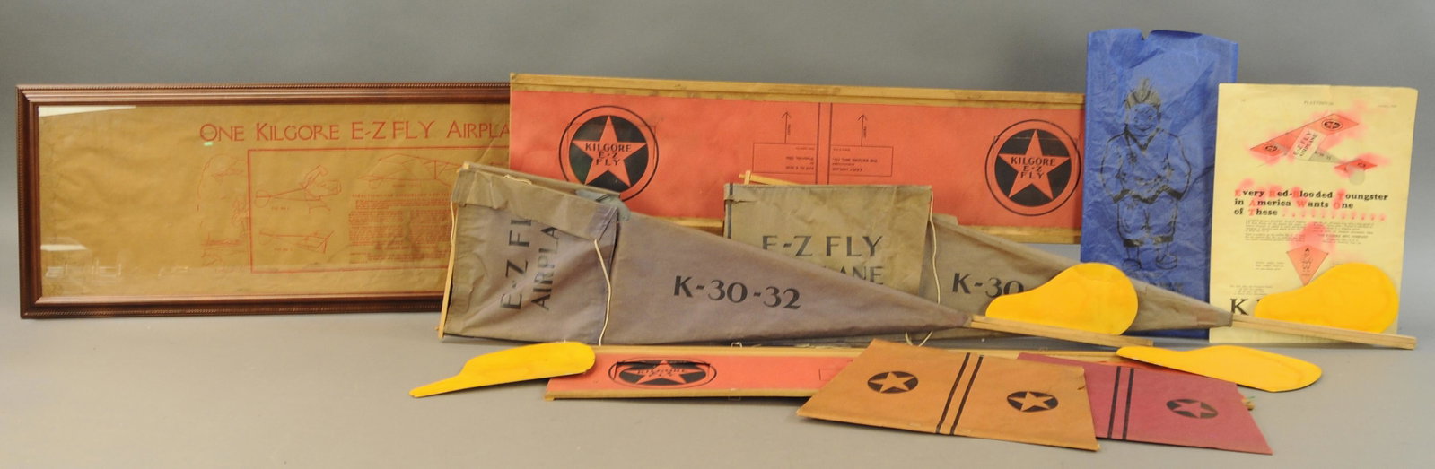 LARGE LOT OF KILGORE KITES: 259. LARGE LOT OF KILGORE KITES | Lot includes two EZ Fly kites (framed envelope) & tailless kite. | 32" l. | All Original Condition. | $150 - $300