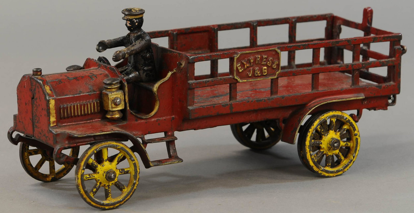 JONES & BIXLER EXPRESS TRUCK: 287. JONES & BIXLER EXPRESS TRUCK | 15" l. | Figure is original, steering wheel and rear gate are replaced, paint in All Original Condition. | $250 - $500