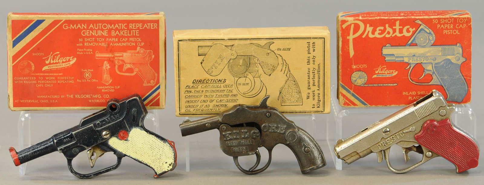 THREE KILGORE CAP PISTOLS W/ BOXES: 307. THREE KILGORE CAP PISTOLS W/ BOXES | Lot includes: a G-man, Presto, & Pistol w/ well. | 5" - 6" l. | G-man trigger inoperable, otherwise in All Original Condition. | $150 - $300