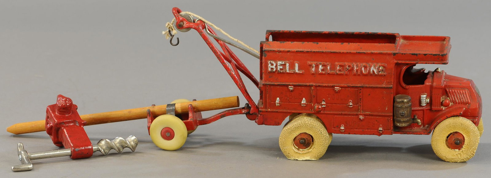 HUBLEY BELL TELEPHONE RED TRUCK: 311. HUBLEY BELL TELEPHONE RED TRUCK | 21" l. | Auger and wrecker bars are replaced, otherwise paint in All Original Condition. | $250 - $500