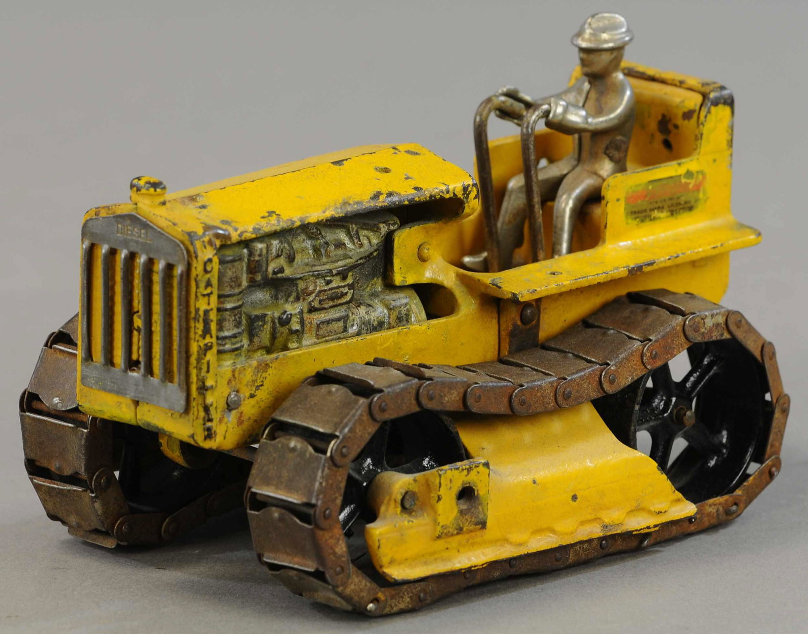 ARCADE CRAWLING CATERPILLAR TRACTOR: 312. ARCADE CRAWLING CATERPILLAR TRACTOR | Provenance: Donald Kaufman Collection. | 7.5" l. | All Original Condition. | $200 - $400