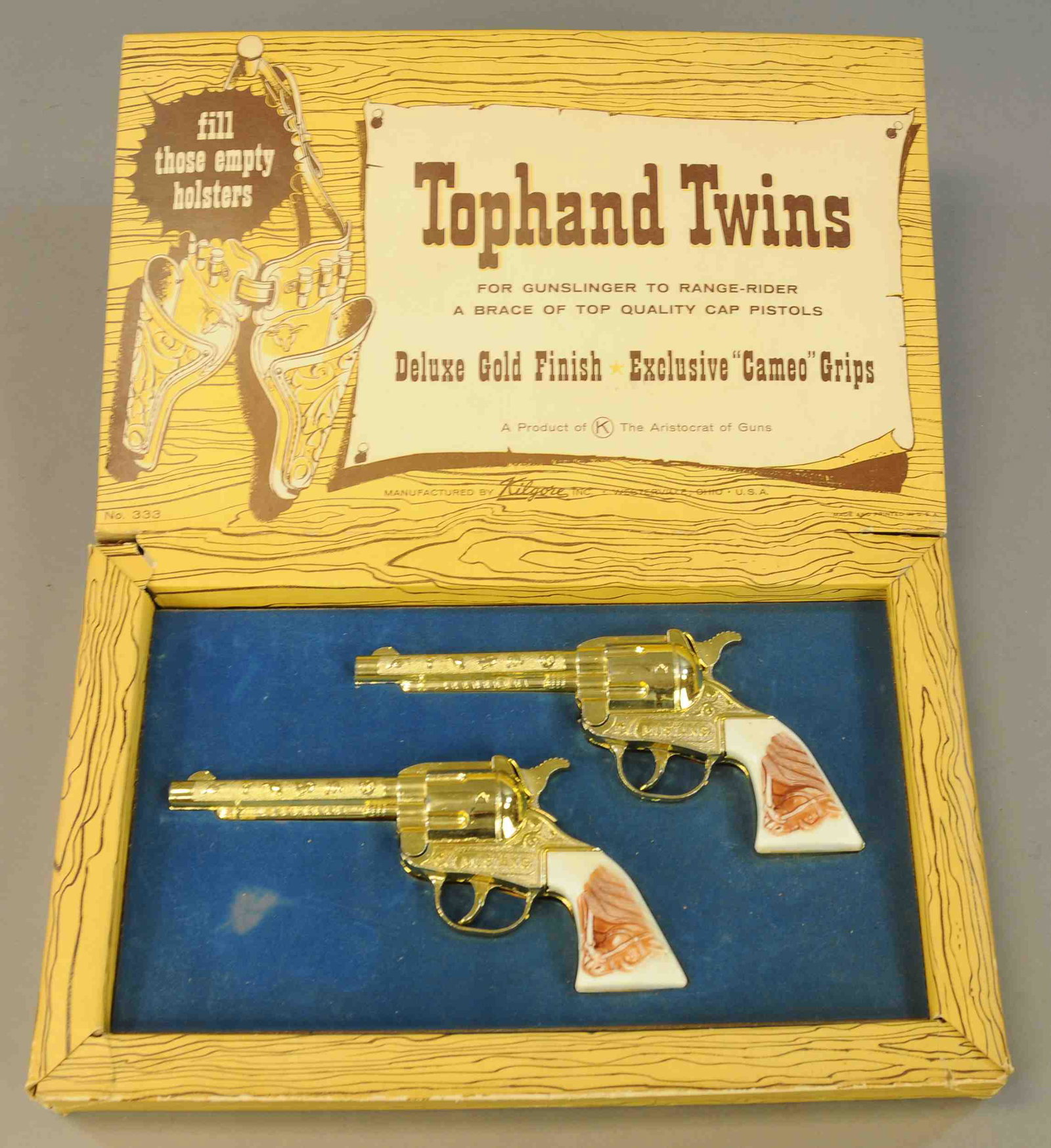 BOXED KILGORE TOPHAND TWINS CAP GUN SET: 322. BOXED KILGORE TOPHAND TWINS CAP GUN SET | 16" w. | some tears to corners of box, guns in All Original Condition. | $200 - $400