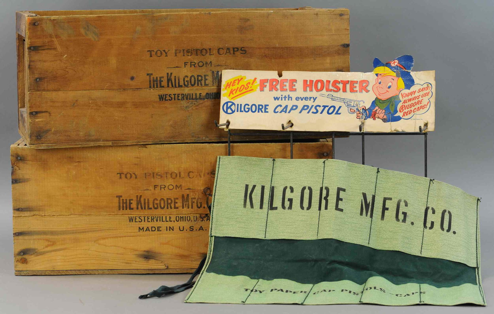 KILGORE APRON AND WOODEN CRATES: 341. KILGORE APRON AND WOODEN CRATES | 27" l. | Cardboard header on display rack distressed. | $100 - $200
