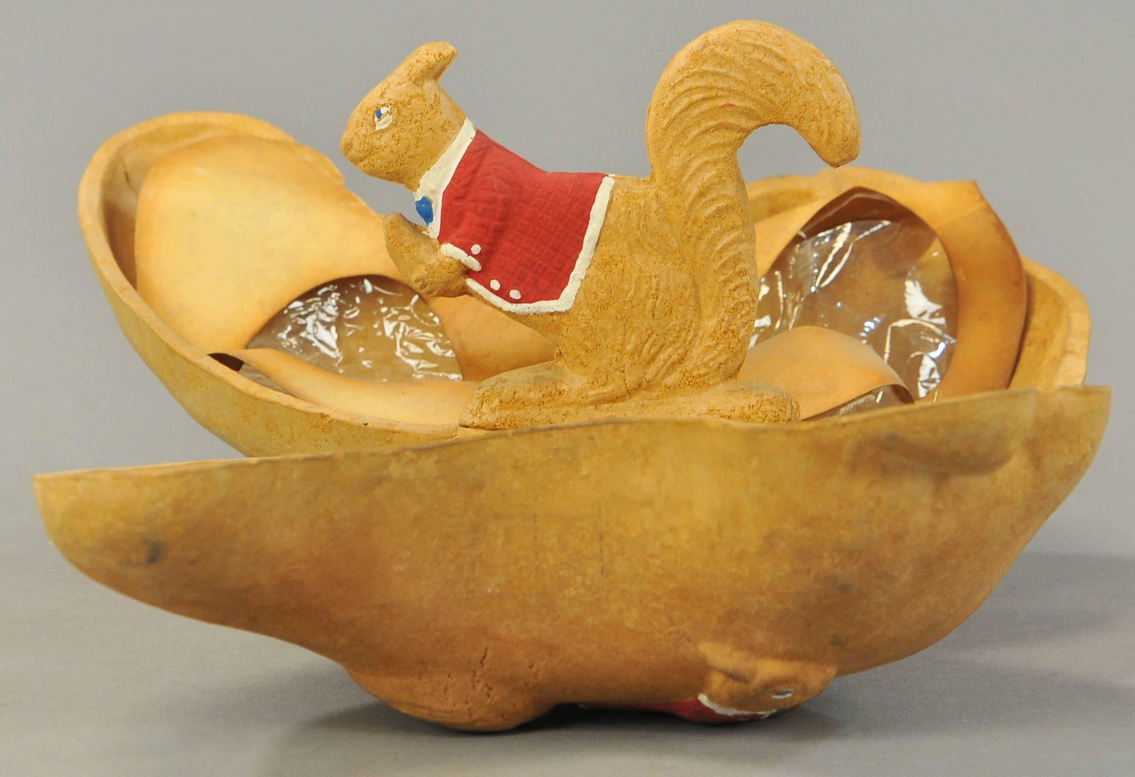 SQUIRREL IN NUT: 361. SQUIRREL IN NUT | Germany, squirrel in nut, composition. | 3" - 9" h. | (VG-Exc. Cond.) | $100 - $200