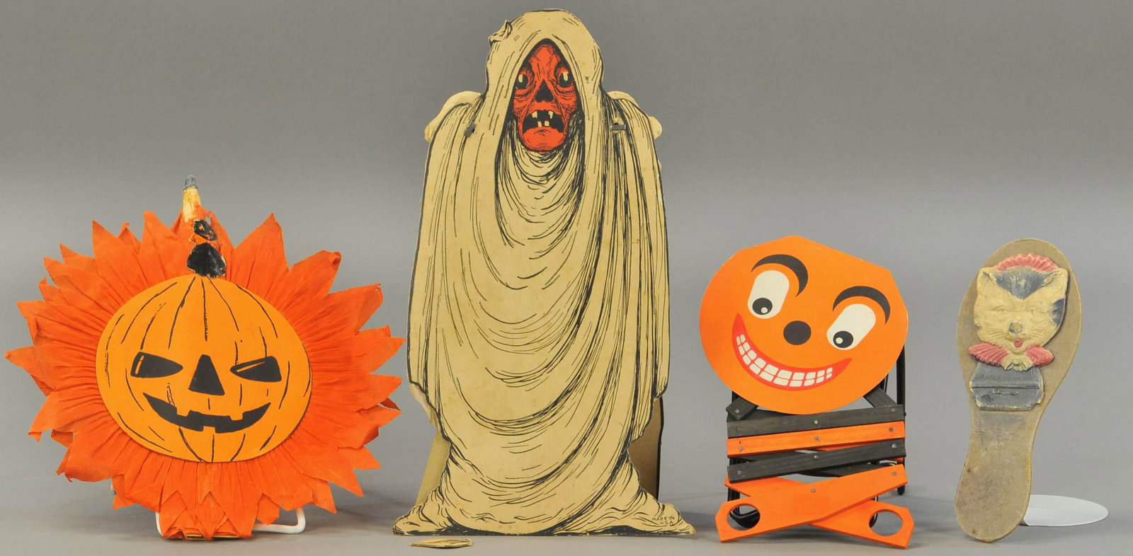 FOUR HALLOWEEN ITEMS: 422. FOUR HALLOWEEN ITEMS | Noisemakers, accordion witch and fold-out ghost. | 6" - 11" l. | (Fair-Good Cond.) | $75 - $150