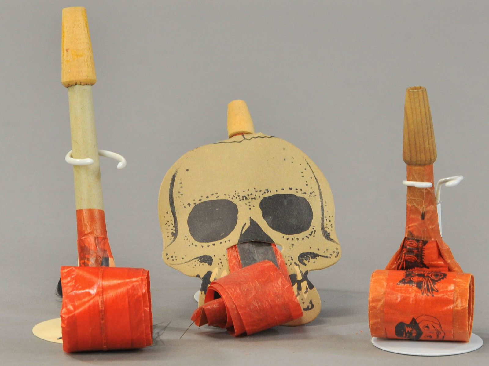 THREE ROLL-OUT NOISEMAKERS: 442. THREE ROLL-OUT NOISEMAKERS | 4" - 6" l. | (Good-VG Cond.) | $100 - $200
