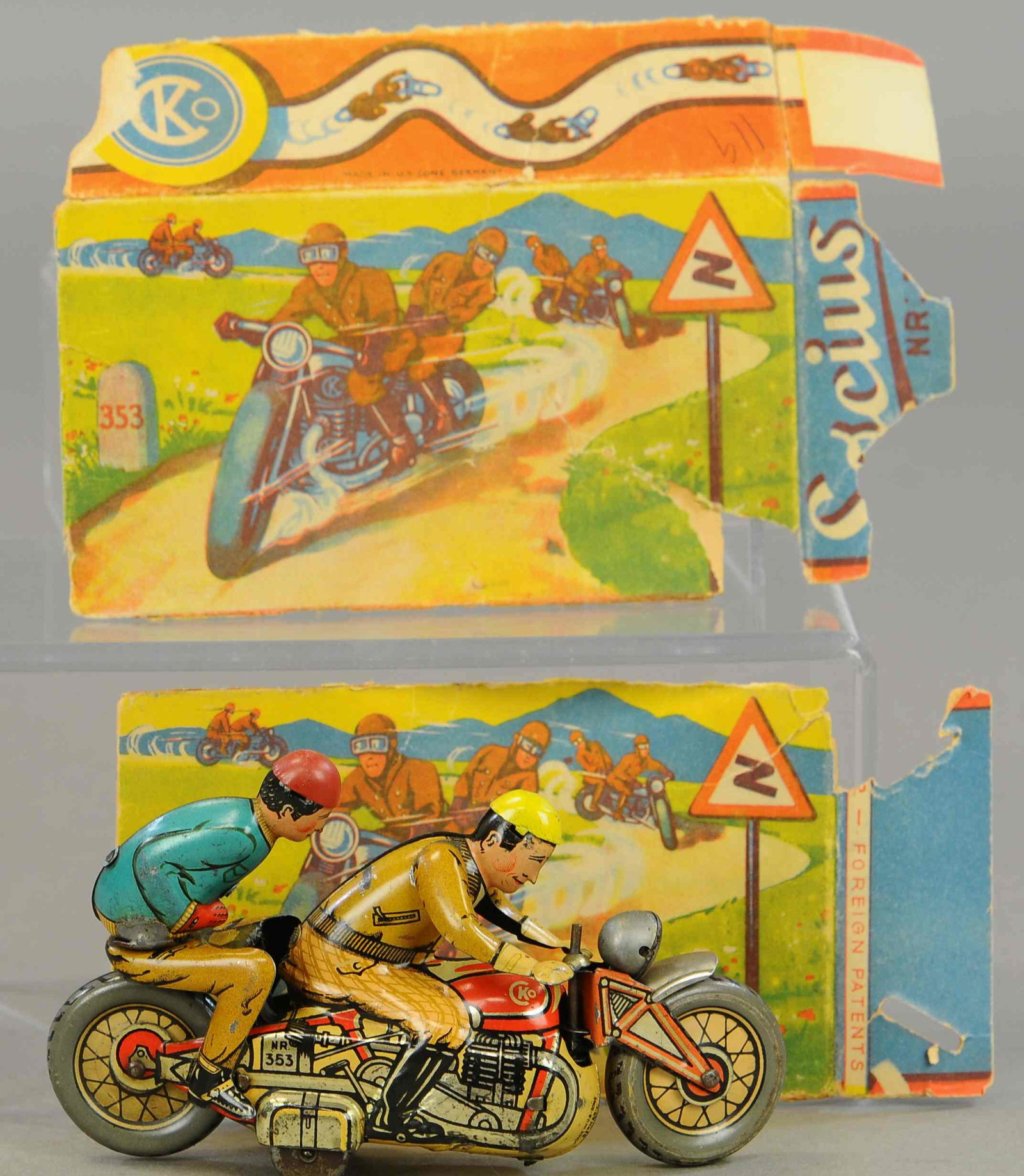 BOXED KELLERMAN RACING CYCLE: 49. BOXED KELLERMAN RACING CYCLE | 5.5" l. | Box is flattened and tattered, original tin passenger figure is reattached, front fork detached from turning mechanism, otherwise in All Original Condition