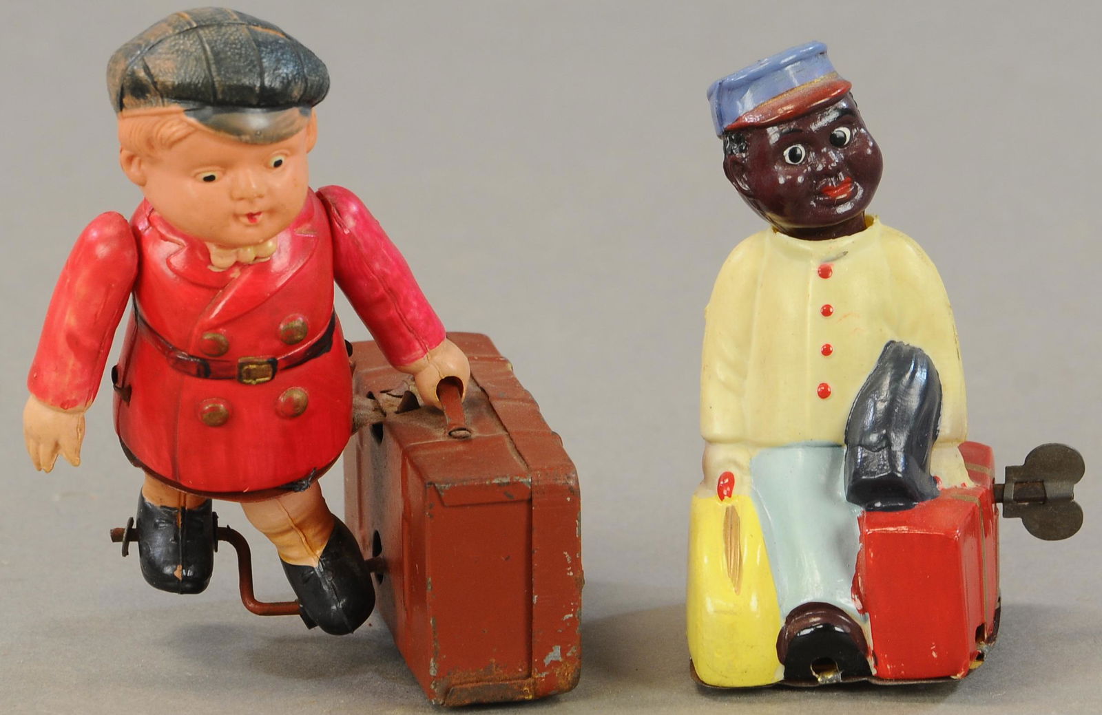 TWO CELLULOID WIND-UP PORTERS (1 of 3)