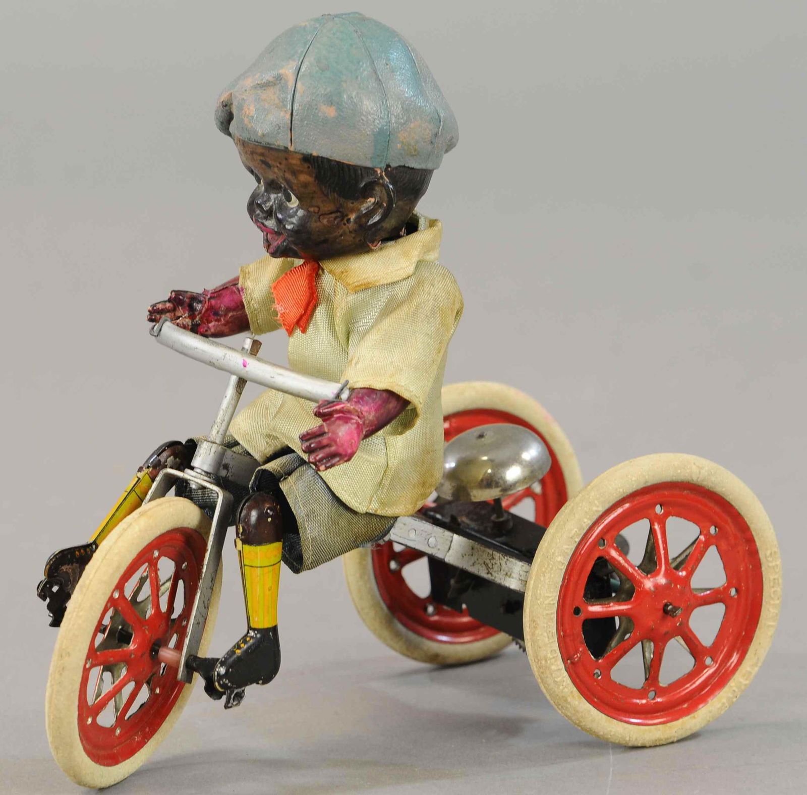 boy on tricycle