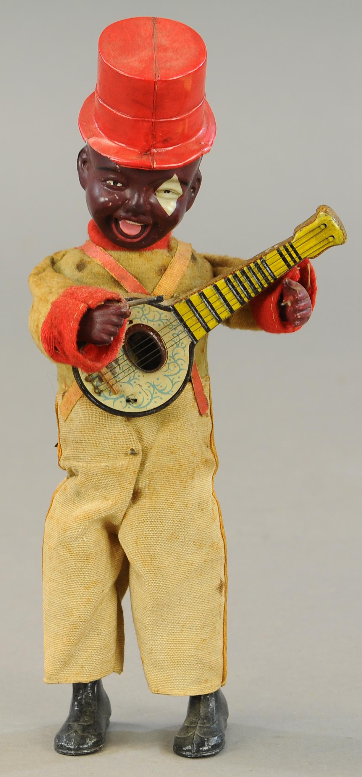 CELLULOID HEAD MECHANICAL BANJO PLAYER (1 of 3)