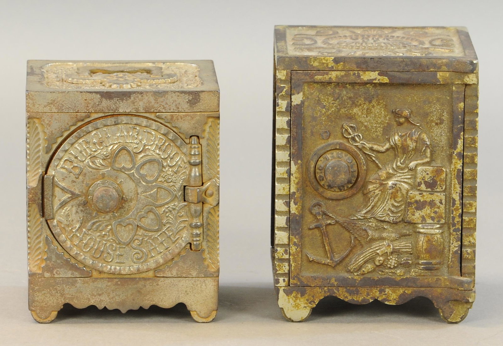 TWO EMBOSSED SAFE STILL BANKS (1 of 1)