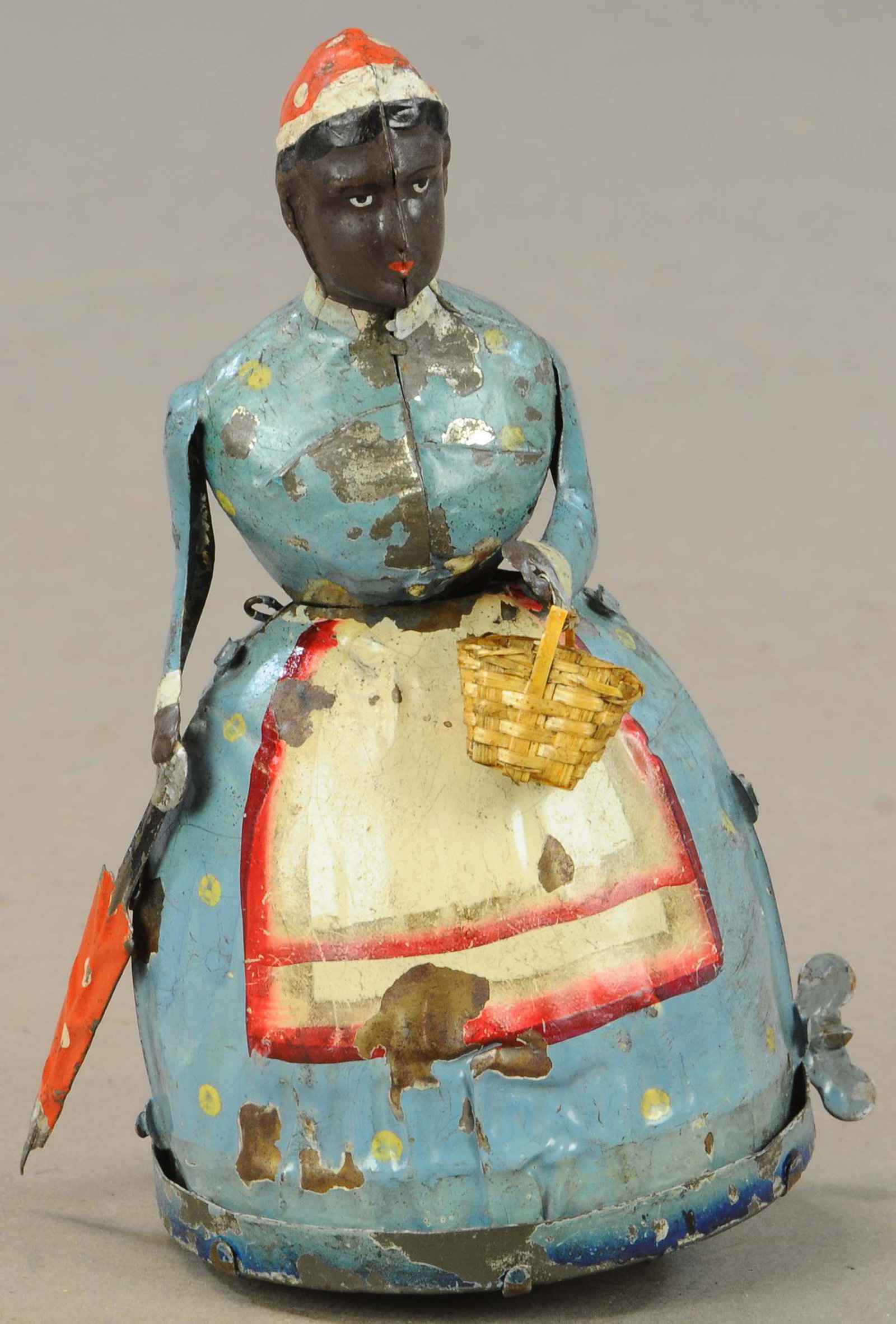 MAX MOSCHKOWITZ WOMAN W/PARASOL: 60. MAX MOSCHKOWITZ WOMAN W/PARASOL | 7" h. | Umbrella is original, arms are reattached and repainted but appear original, head has some enhancement to paint. | $300 - $600