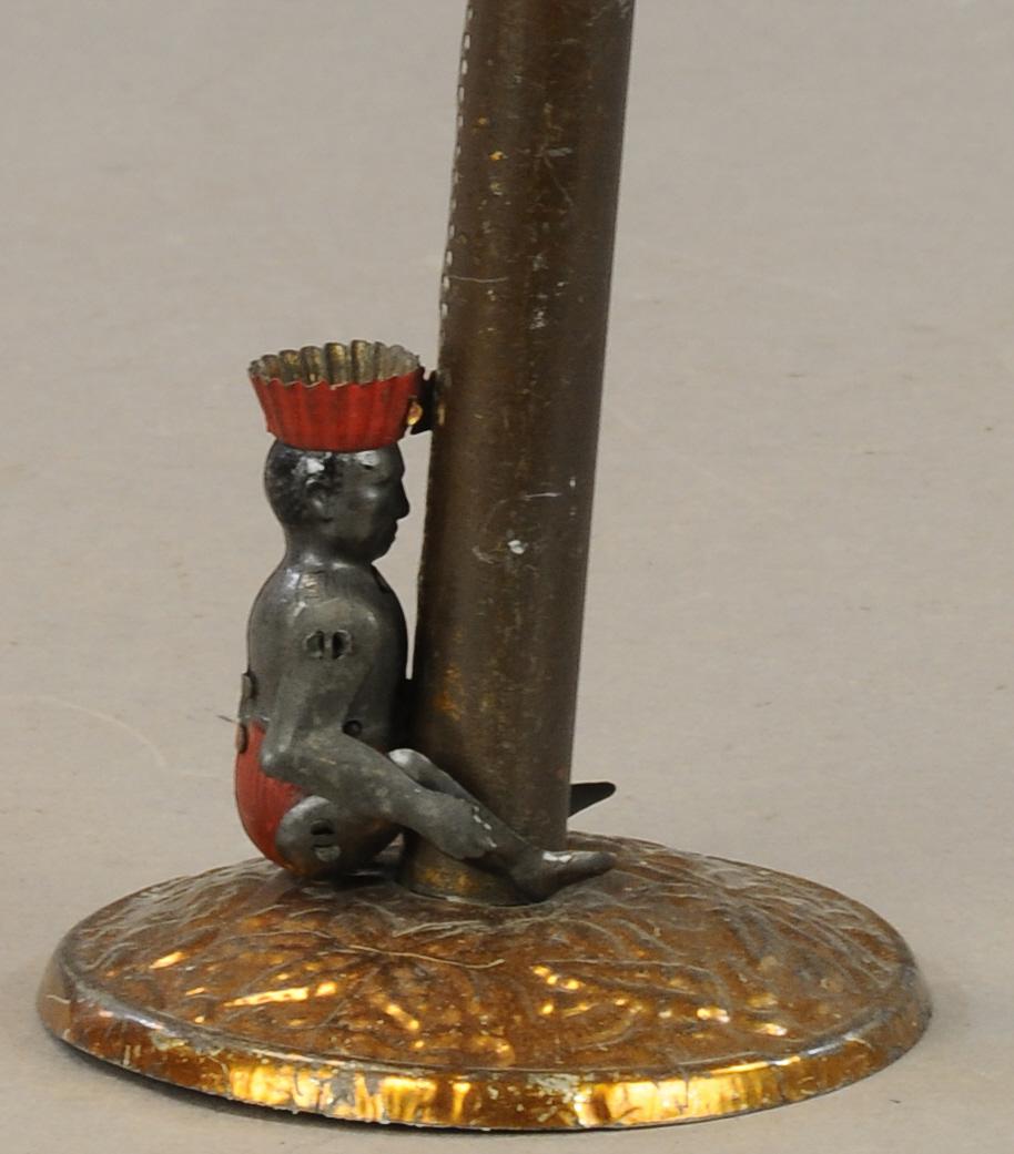BRITISH COPY OF LEHMANN COCO: 63. BRITISH COPY OF LEHMANN COCO | Made by Joseph Walker, though the debate stands for who made the COCO toy first, Germany or Britain. | 19" h. | Missing cloth palm tree leaves at top, otherwise in A