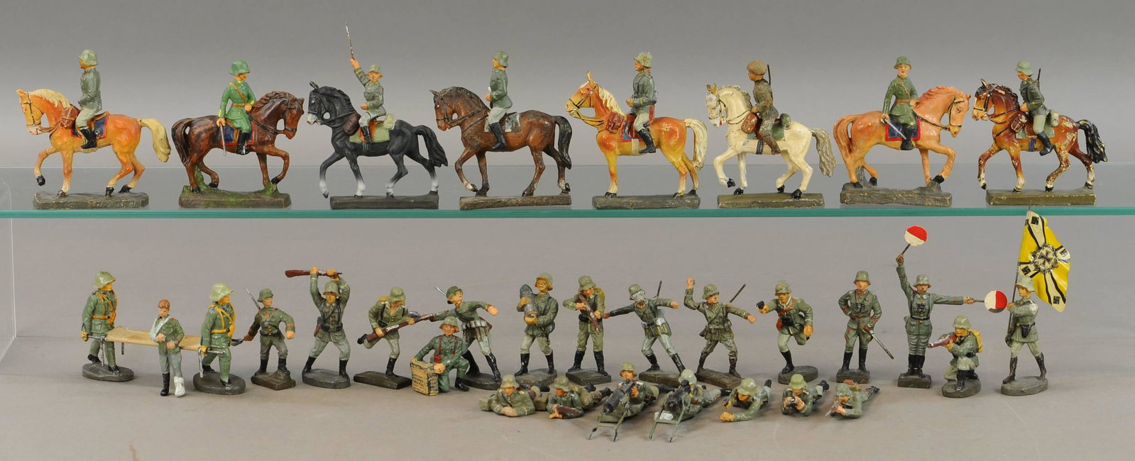 LINEOL-ELASTOLIN GERMAN SOLDIERS 33 PC.: 68. LINEOL-ELASTOLIN GERMAN SOLDIERS 33 PC. | 2" - 4" l. | Average wear overall, All Original Condition. | $300 - $600