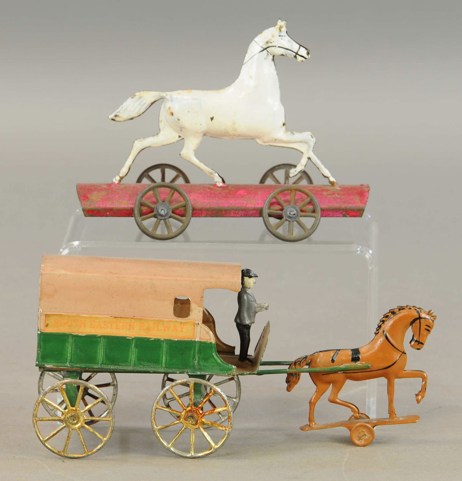 TWO EUROPEAN HORSE THEME TIN TOYS: 169. TWO EUROPEAN HORSE THEME TIN TOYS | 7" - 9" l. | All Original Condition. | $200 - $400