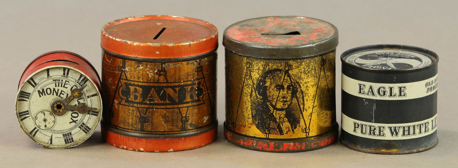 FOUR AMERICAN TIN BANKS - IVES DRUM: 201. FOUR AMERICAN TIN BANKS - IVES DRUM | 2" - 3" l. | All Original Condition. | $100 - $200