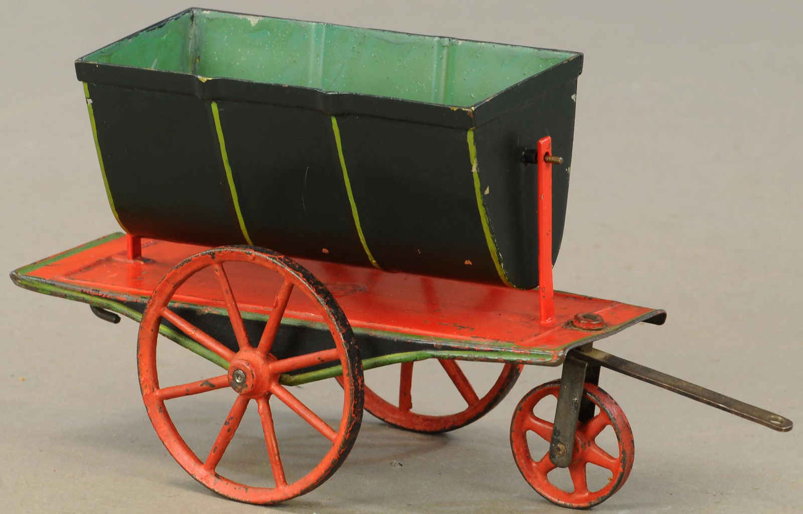 MARKLIN PULL TOY FLOOR TRAIN TIP CART: 283. MARKLIN PULL TOY FLOOR TRAIN TIP CART | Floor toy without flanges on wheels, hand painted. | 7" l. | Repair and repaint to posts, tip body replaced. | $400 - $800