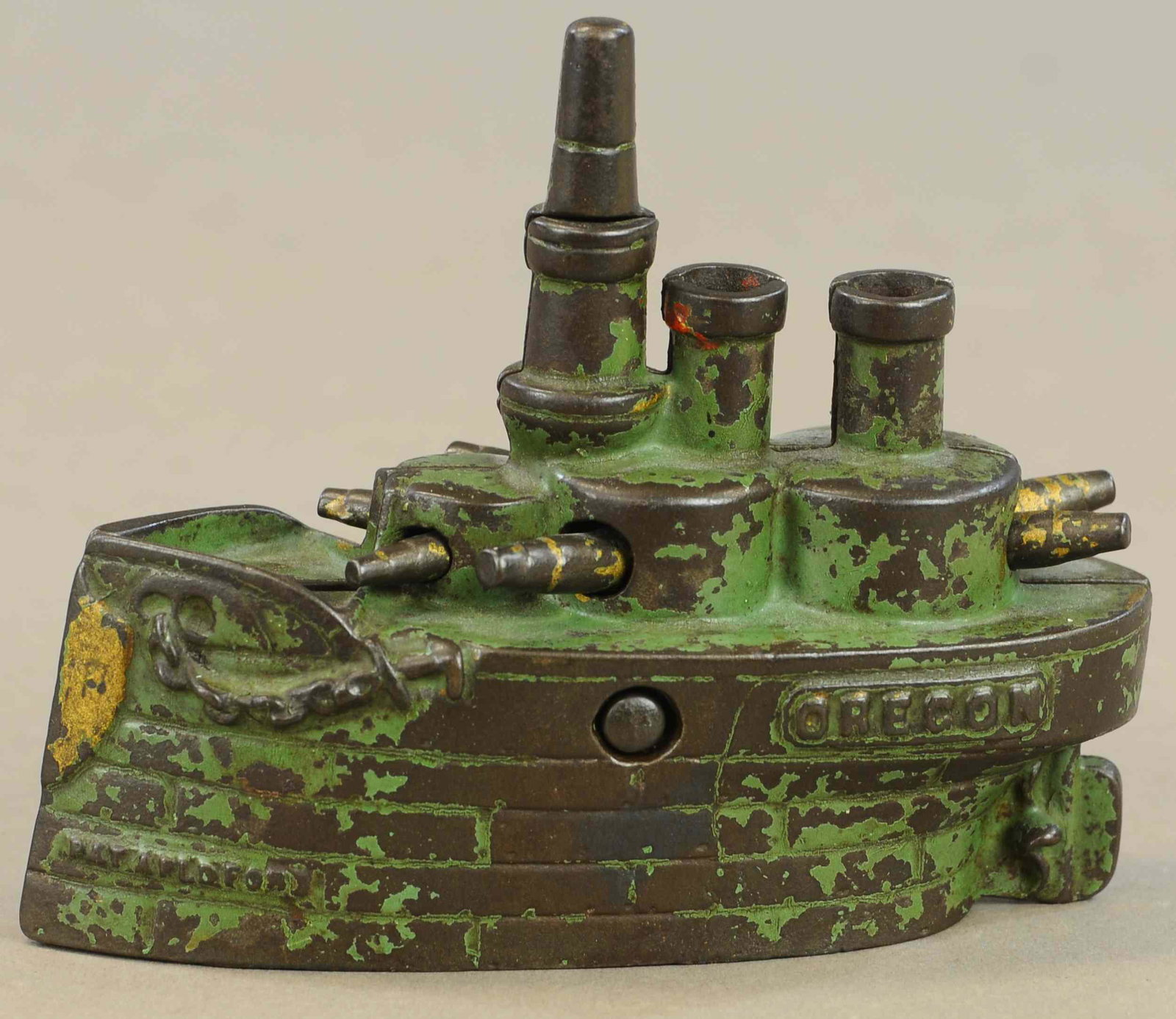 LARGE GREEN BATTLESHIP OREGON STILL BANK: 357. LARGE GREEN BATTLESHIP OREGON STILL BANK | 6.5" l. | All Original Condition. | $125 - $250