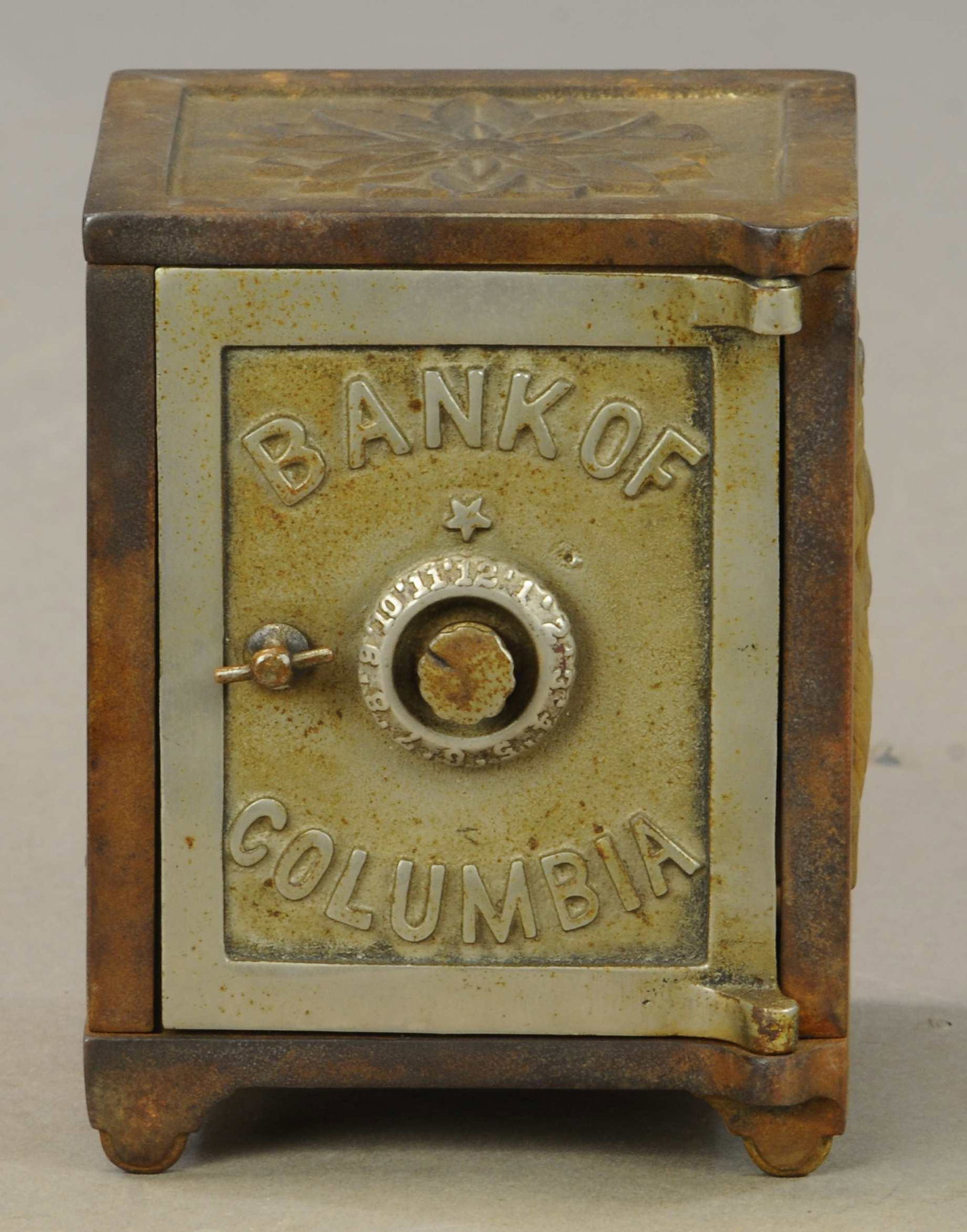UNCLE SAM COLUMBIA SAFE STILL BANK: 418. UNCLE SAM COLUMBIA SAFE STILL BANK | 5.5" h. | Piece chipped out of one side panel, otherwise could use cleaning in All Original Condition. | $150 - $300