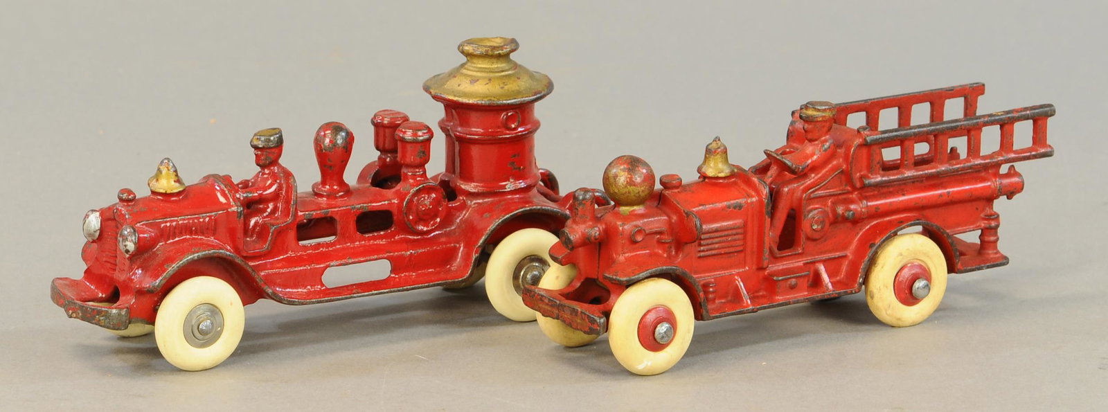 TWO SMALL FIRE ENGINE TOYS - AHRENS FOX: 512. TWO SMALL FIRE ENGINE TOYS - AHRENS FOX | 7.5" l. | Pumper has three replacement tires, paint in All Original Condition. | $300 - $600