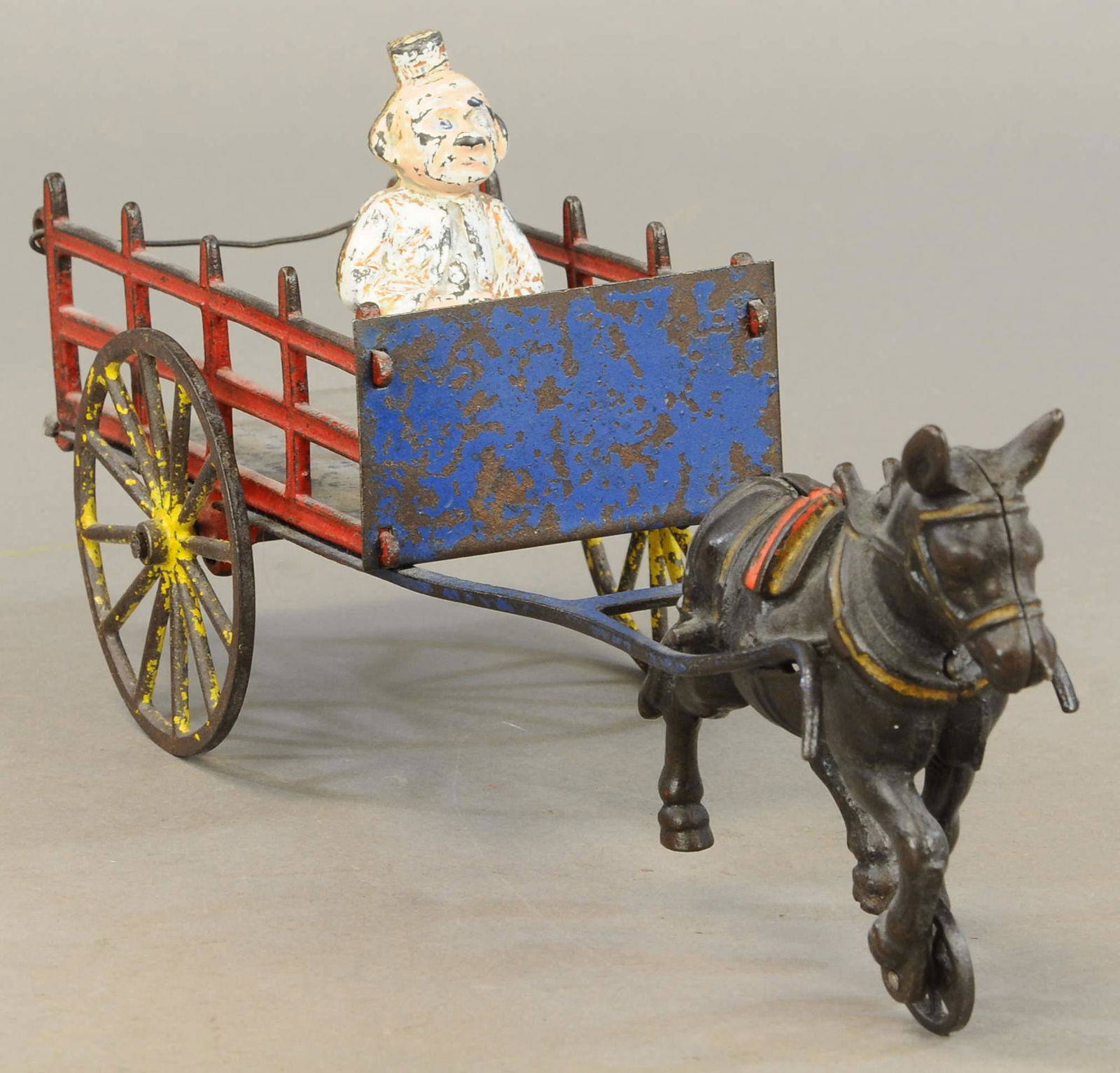 HAPPY HOOLIGAN STAKE WAGON: 569. HAPPY HOOLIGAN STAKE WAGON | 14" l. | All Original Condition. | $150 - $300