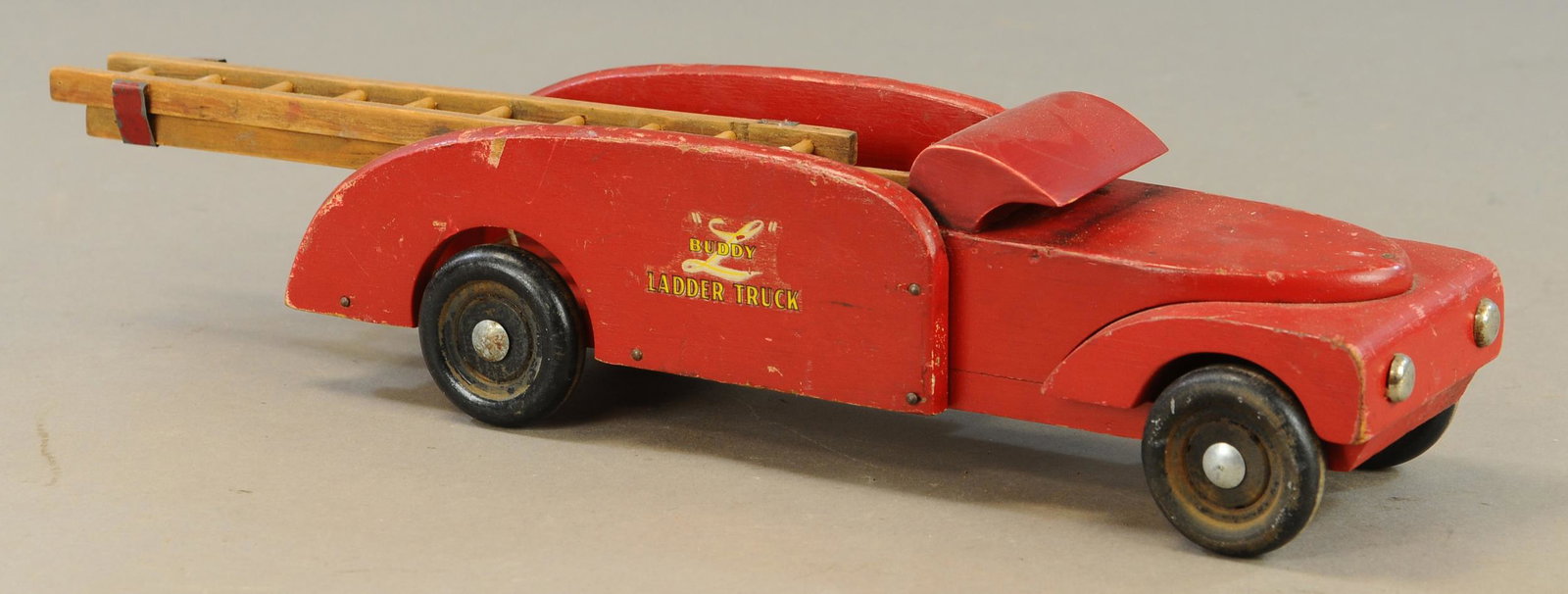 BUDDY L WOOD LADDER TRUCK: 650. BUDDY L WOOD LADDER TRUCK | 20" l. | Roof/cab section is replaced, otherwise in All Original Condition. | $75 - $150