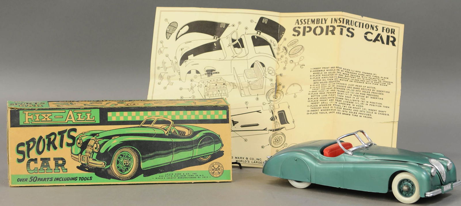 BOXED MARX FIX-ALL SPORTS CAR: 654. BOXED MARX FIX-ALL SPORTS CAR | Includes paper bag for tools, tools, and instructions. | 12" l. | One box flap is torn but present, others missing, toy in All Original Condition. | $150 - $300
