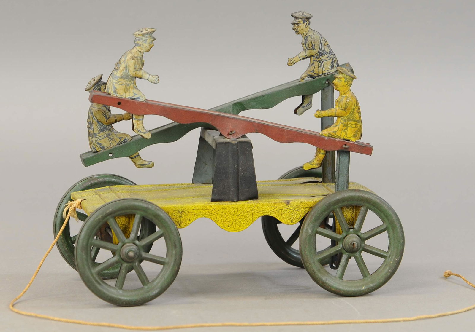 NONPARIEL SEE-SAW PULL TOY: 655. NONPARIEL SEE-SAW PULL TOY | 10" l. | All Original Condition. | $100 - $200