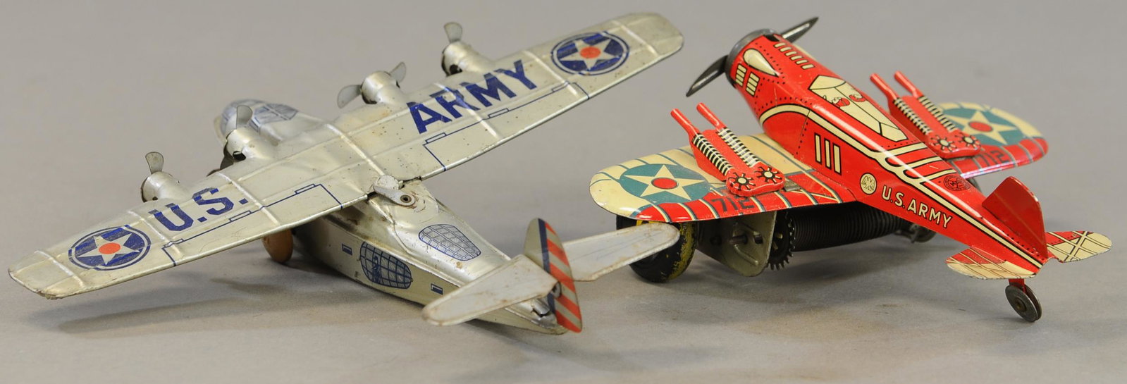 TWO AIRPLANES WIND-UPS CHEIN/MARX: 710. TWO AIRPLANES WIND-UPS CHEIN/MARX | 8" - 11" wingspans. | Chein plane wind-up is inactive and missing rear wheel, otherwise All Original Condition. | $125 - $250