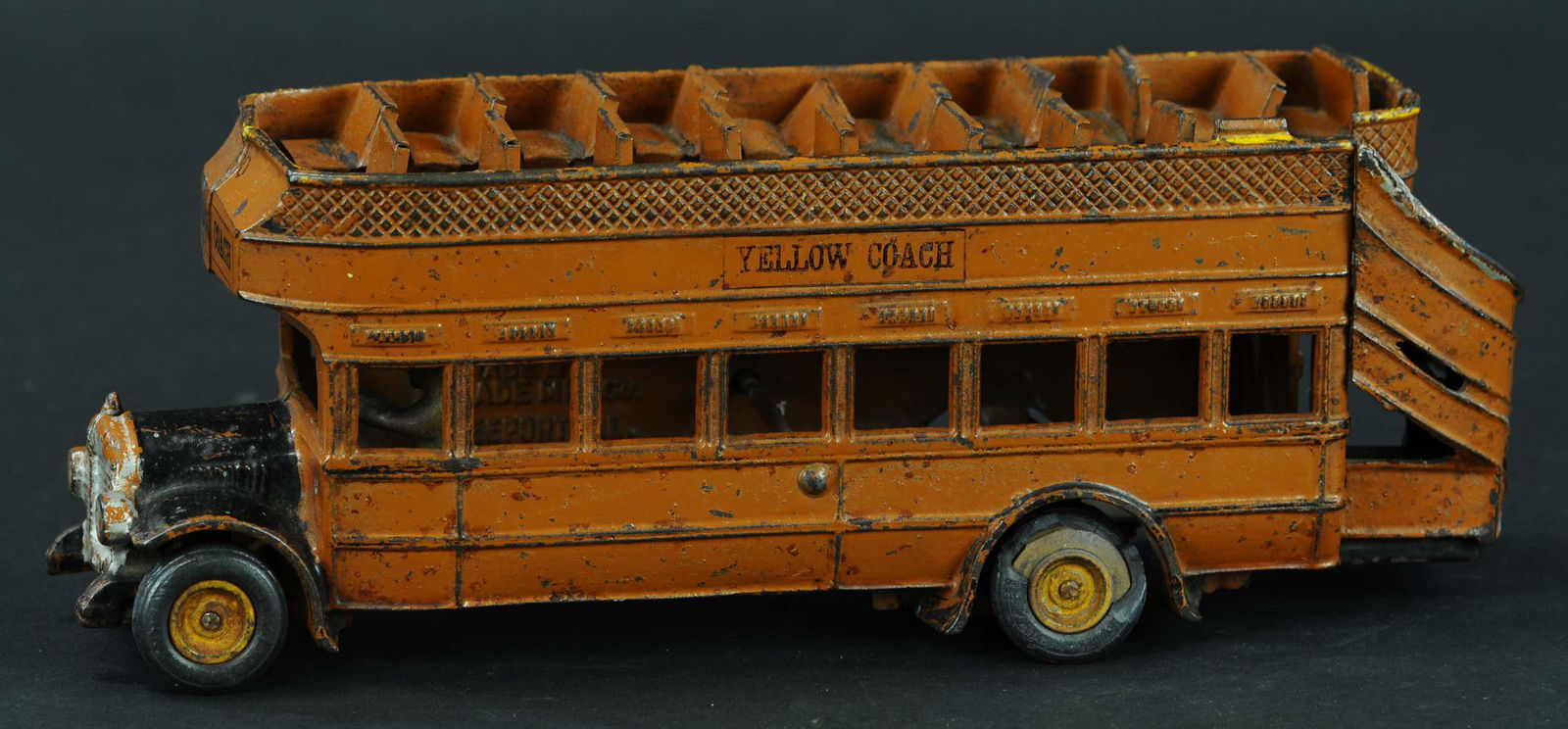 ARCADE YELLOW COACH BUS: 56. ARCADE YELLOW COACH BUS | Circa 1926, a large and quite detailed toy which is hard to find in all original condition. | 13" l. | (Very Good Condition) | $700 - $1,000