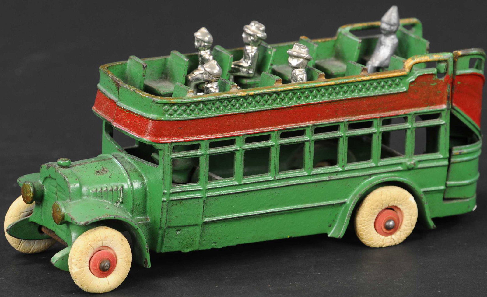 KENTON DOUBLE DECKER BUS: 79. KENTON DOUBLE DECKER BUS | Second largest in series with nickeled figures. | 10" l. | Original rear stairs have a crack through middle, otherwise in (Excellent Condition) | $600 - $800