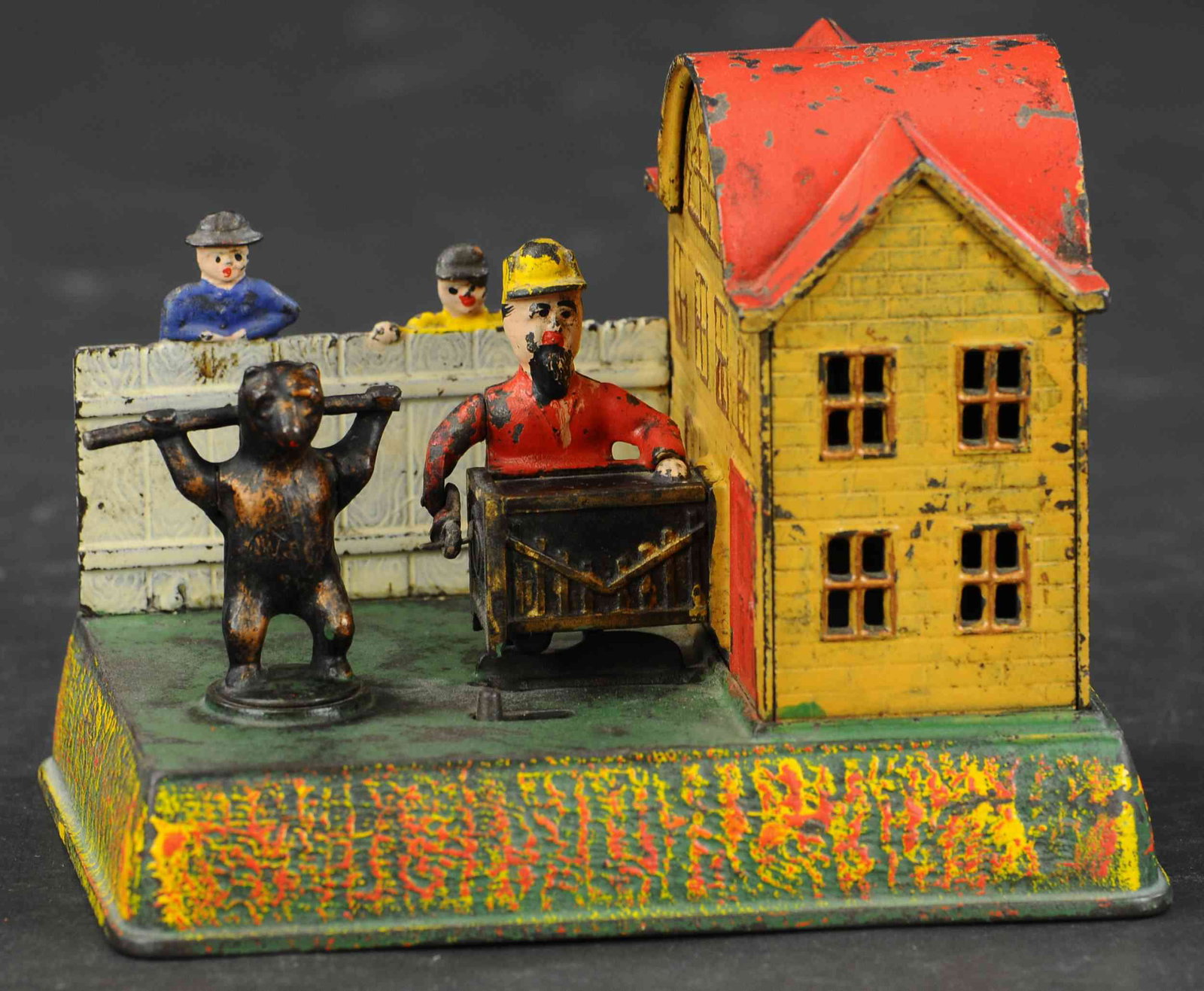 ORGAN GRINDER & PERFORMING BEAR BANK: 152. ORGAN GRINDER & PERFORMING BEAR BANK | Kyser & Rex, circa 1882, one of the more fascinating clockwork action banks, when wound and activated the bear actually revolves as organ grinder turns orga