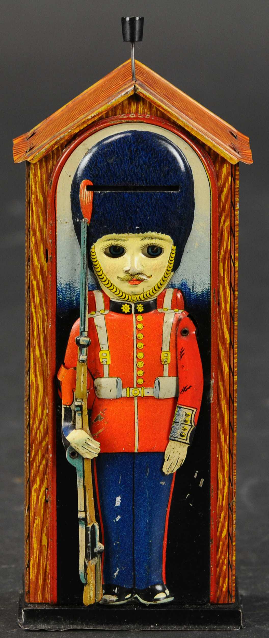 SENTRY TIN MECHANICAL BANK: 186. SENTRY TIN MECHANICAL BANK | Saalheimer & Strauss of Germany, c. 1920's, lithographed tin bank with amusing action. | (Excellent to Pristine Condition) | $400 - $600